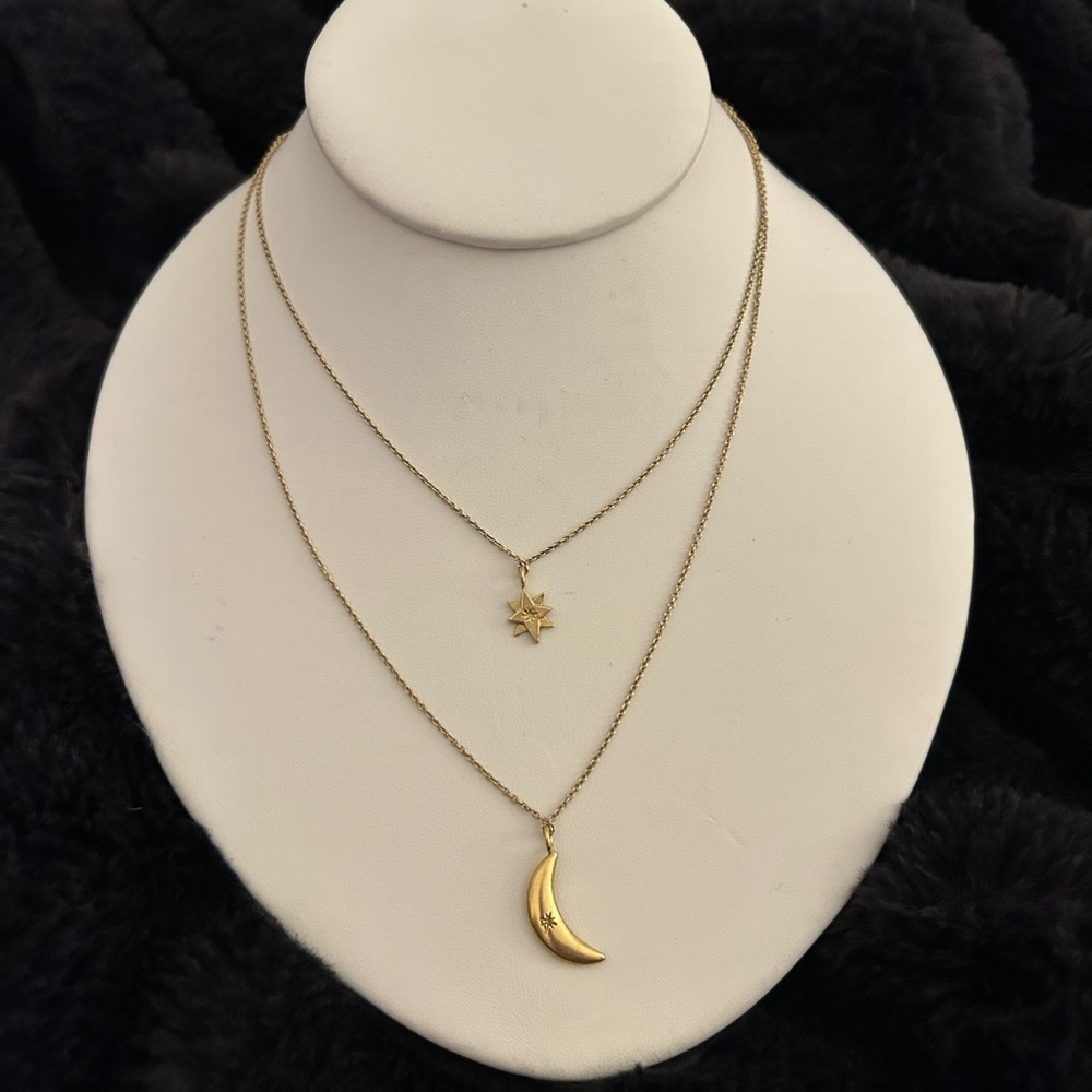 Logan Hollowell layered gold necklace with star and moon pendants